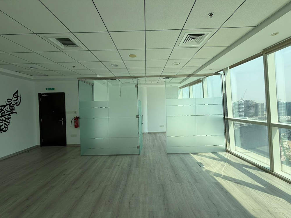 Fully fitted office space with glass partitions and canal views for rent in B2B Tower, Business Bay