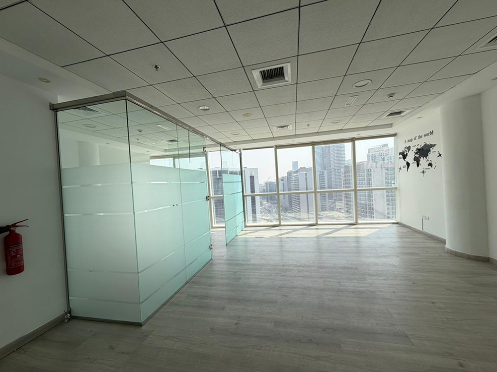 Fully fitted office space with glass partitions and canal views for rent in B2B Tower, Business Bay